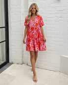 Women's red multi floral mini dress styled outfit by Esther & Co