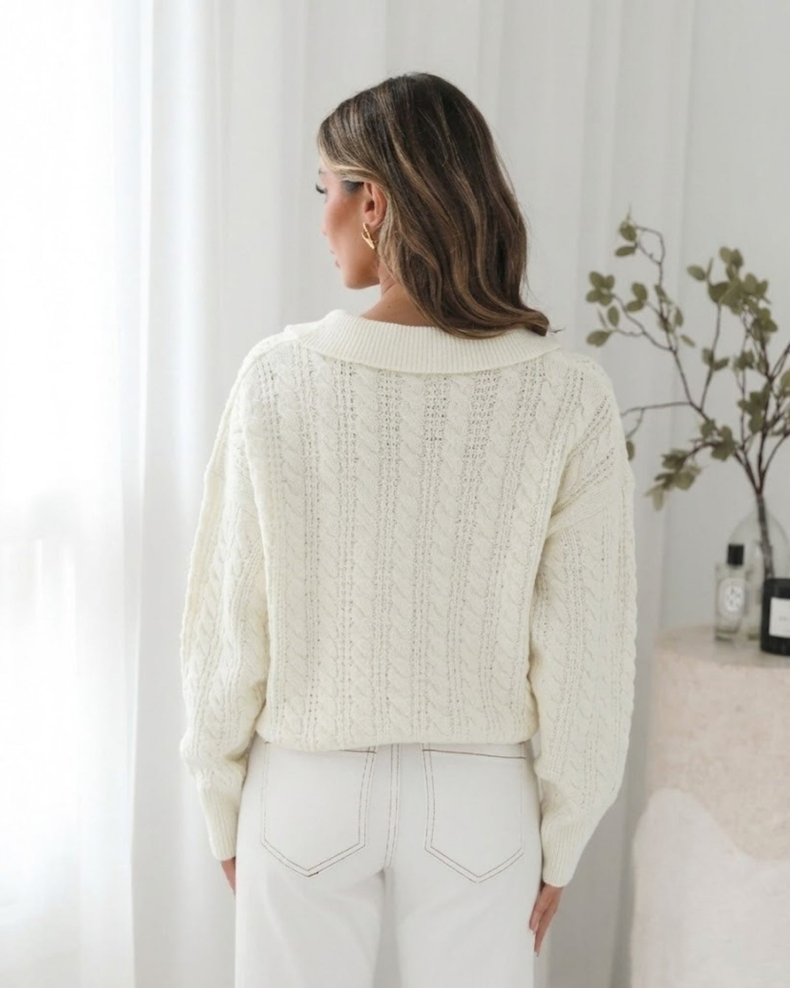 Cream cable knit texture and ribbed cuff detail