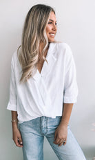 Plato Top in White white linen blouse with twist hemline side view