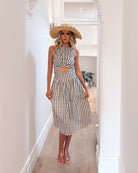 Rafiya Dress in Navy Stripe navy and white stripe midi dress with cutout waist side view