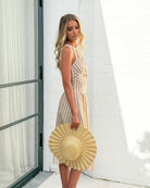 Rafiya Dress in Tan Stripe tan and white stripe sleeveless midi dress side view