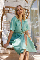 Women's sage collared poplin midi dress with waist cutout and centre-front buttons, the Rashka Dress in Sage by Esther & Co