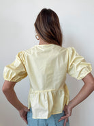 Women's yellow cotton peplum top back view by Esther & Co