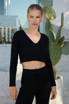Women's black v neck cropped knit top with long sleeves, the Reanne Knit Top in Black by Esther & Co