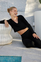 Women's black long sleeve cropped knit top by Esther & Co