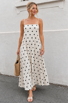 Women's beige polka dot maxi dress with straight neckline and spaghetti straps, the Rhiannon Beige Spot Dress by Esther & Co