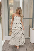 Women's beige polka dot maxi dress styled outfit by Esther & Co