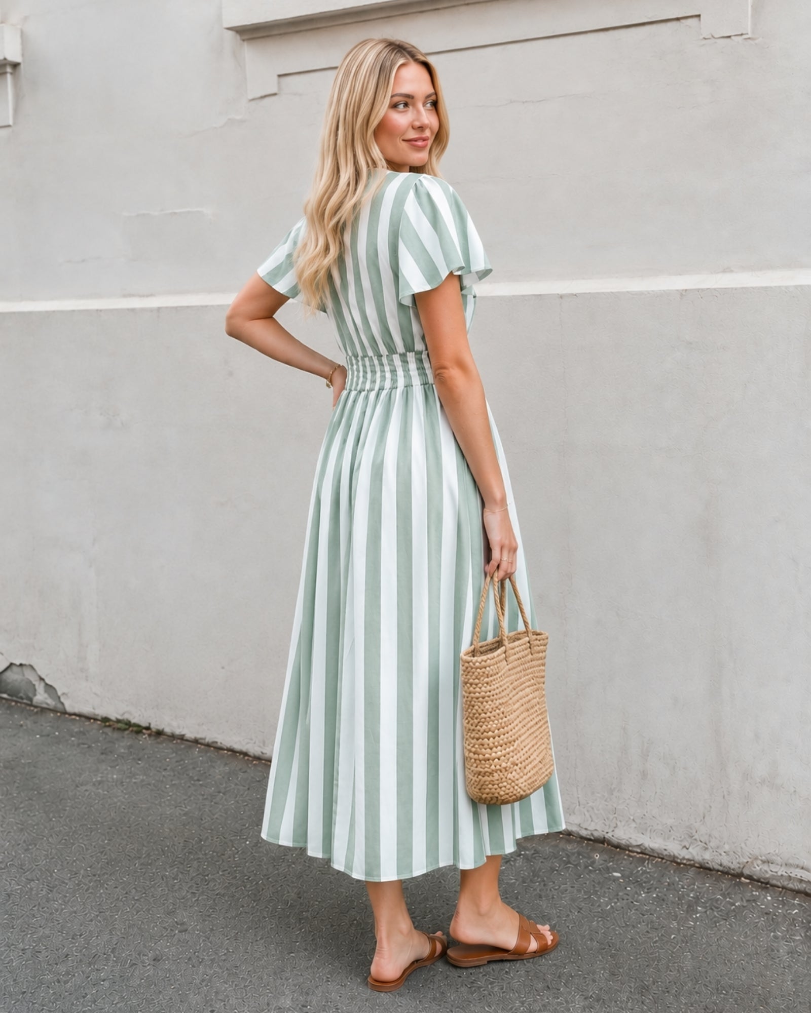 Women's green striped A-line midi dress side view by Esther & Co