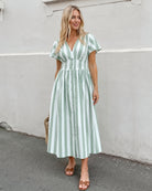 Women's green and white striped midi dress with flutter sleeves, the Rhona Dress in Green Stripe by Esther & Co