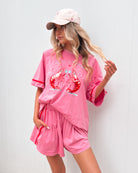 Women's pink stripe shorts styled with a matching t-shirt by Esther & Co