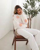 Ryland Knit in White Floral white knit with 3D crochet floral appliques side view