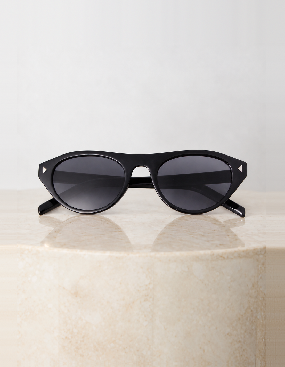 Women's glossy black acetate cat eye sunglasses with dark grey lenses, the Kiwi Sunglasses in Black by Esther & Co