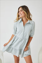 Women's light blue cotton shirt dress with tiered skirt and cuffed sleeves, the Sanaz Dress in Light Blue by Esther & Co