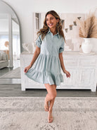 Women's light blue tiered shirt dress styled for work by Esther & Co
