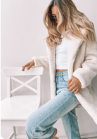 Women wearing the Bernie Jacket in Ivory, a classic relaxed textured jacket with collar neckline and button-up front