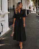 Women's black v-neck wrap dress with gold ring waist detail, the Sephora Dress in Black by Esther & Co