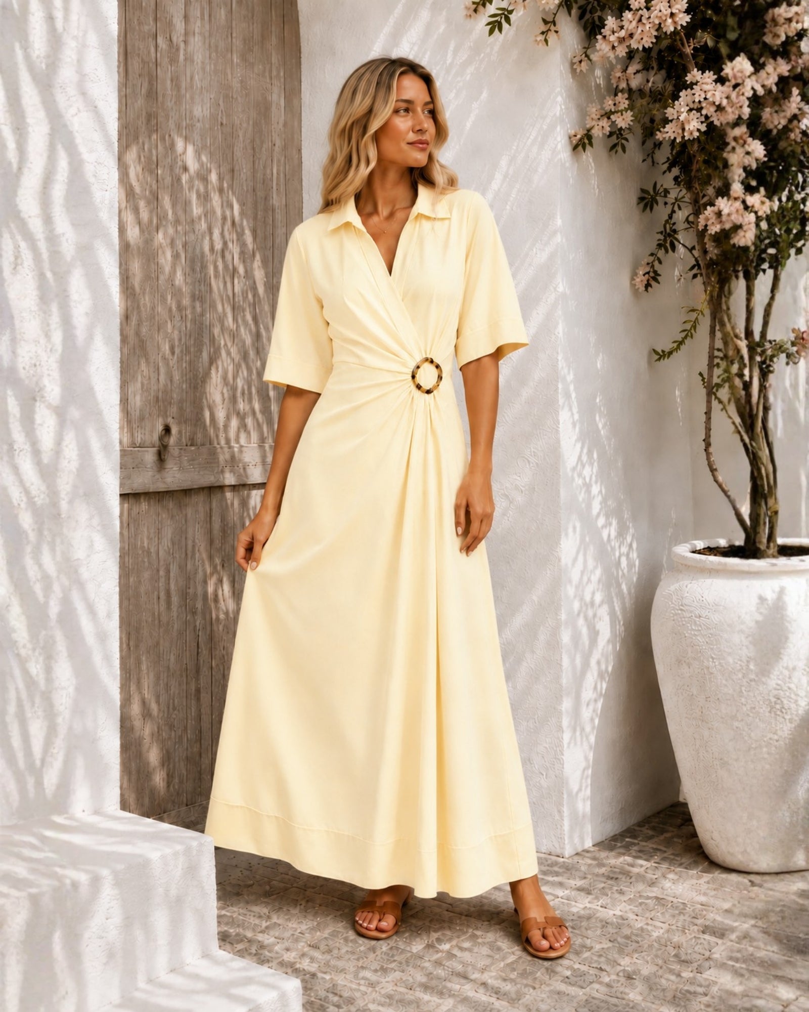 Women's pastel yellow short sleeve wrap dress with A-line skirt, the Sephora Dress in Buttercream by Esther & Co