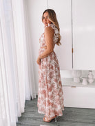 Women's peach floral maxi dress with low v neckline by Esther & Co