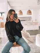 Sharisse Knit in Black black knit jumper with lace sleeve detail side view
