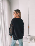 Sharisse Knit in Black black relaxed fit knit with lace sleeves back view