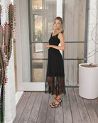 Sheneka Dress in Black Lace black lace overlay midi dress side view