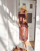 Front view of the Syvella Brown Floral Maxi Dress showing the square neckline and relaxed silhouette