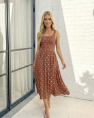 Women's rust polka dot midi dress styled outfit by Esther & Co