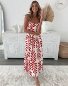 Women's red print midi dress styled outfit by Esther & Co