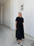 Influencer wearing the Iolana Black Midi Dress from Esther and Co showing the versatile everyday styling