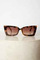 Tortoiseshell frame sunglasses with dark lenses, the Landon Sunglasses in Tortoise by Esther & Co