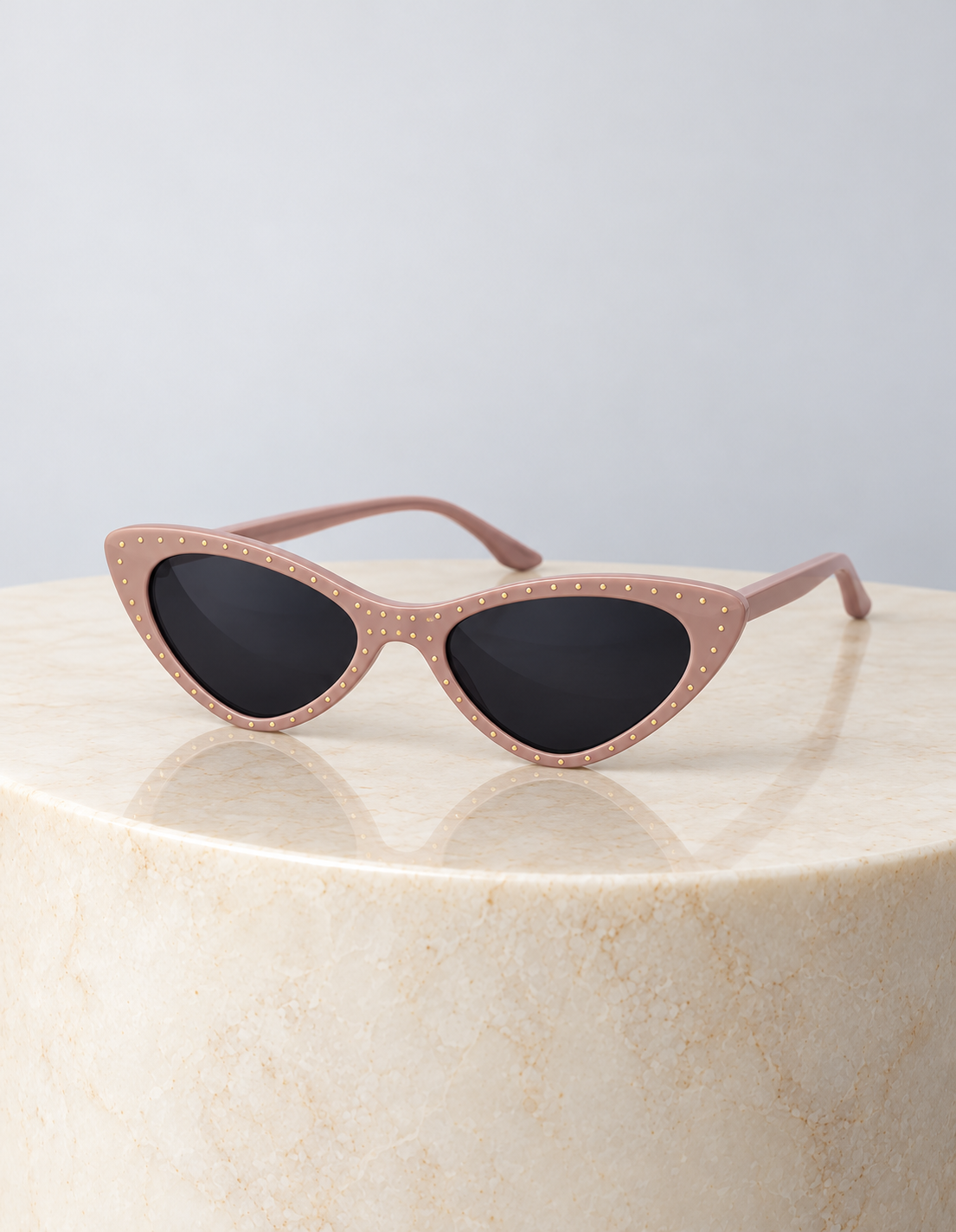 Paris Blush Sunglasses on a round cream marble plinth