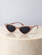 Paris Blush Sunglasses on a round cream marble plinth