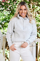Front view of the Merete Grey Knit showing the distinctive high collar and zip detail