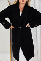 Front view of the Fireplace Coat Black showing the open-front longline silhouette and faux button detail