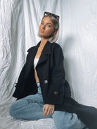Fireplace Coat in Black classic black knit trench coat close up detail