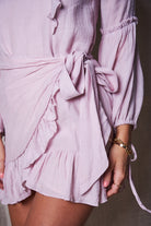 Women's blush pink bishop sleeve midi dress back view by Esther & Co