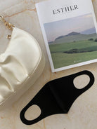 Women's black reusable face mask detail view by Esther & Co