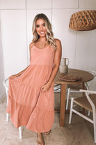 Sonya rust linen midi dress with V-neckline, front view