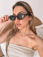 Margot black sunglasses, folded view