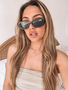 Margot black sunglasses, angle view