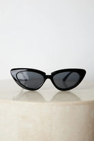 Black frame sunglasses with dark lenses, the Finlay Sunglasses in Black by Esther & Co