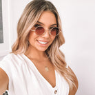 Rose gold frame sunglasses with transparent blush lenses, the Monaco Sunglasses in Blush by Esther & Co